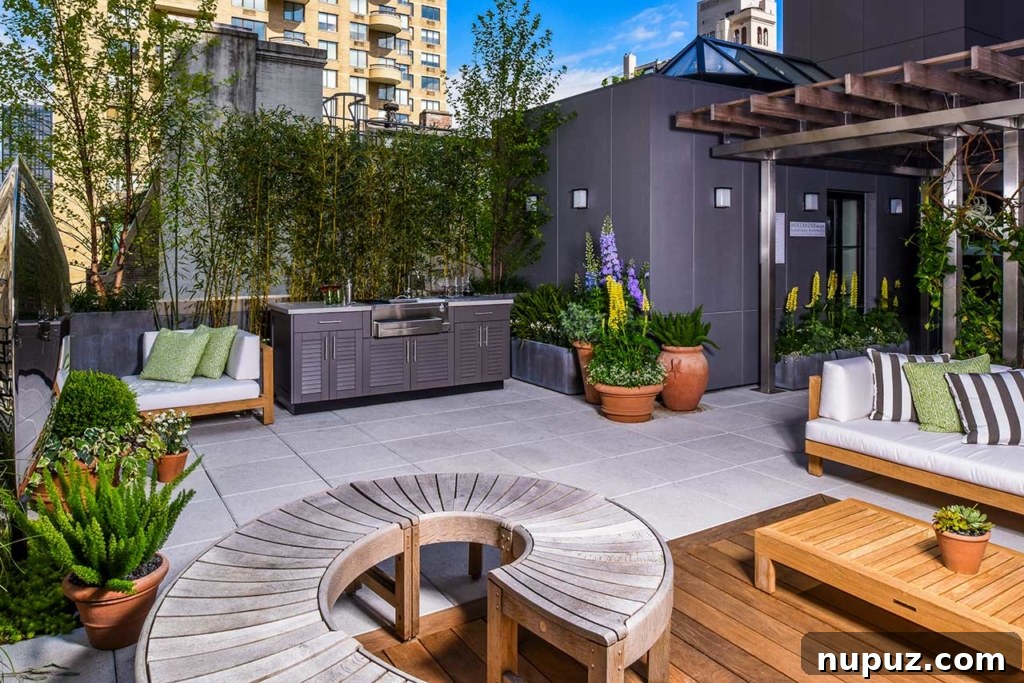 Elegant outdoor kitchen with a large preparation island and modern appliances