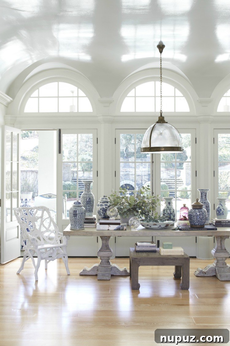 Curating Beauty with Beth Webb Interiors 7 Beth Webb Interiors formal dining room with elegant chandelier, sophisticated place settings, and traditional details