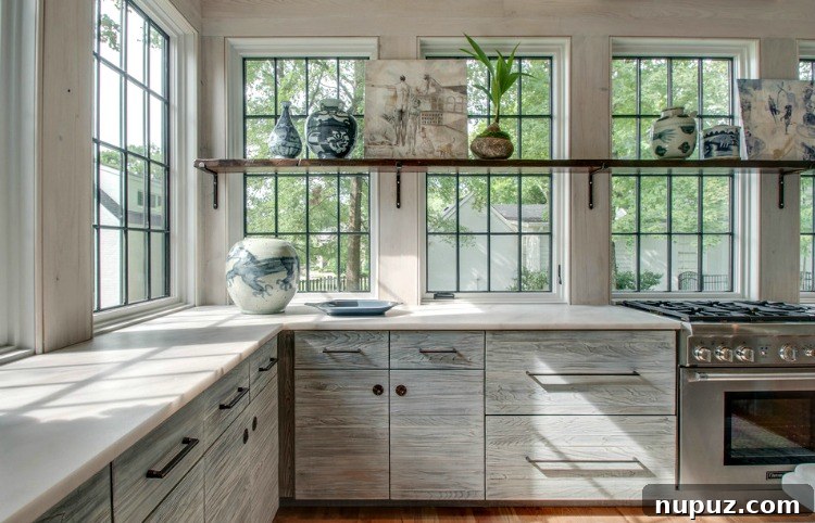 Elegant dining area with high ceilings and custom architectural details by Jeffrey Dungan