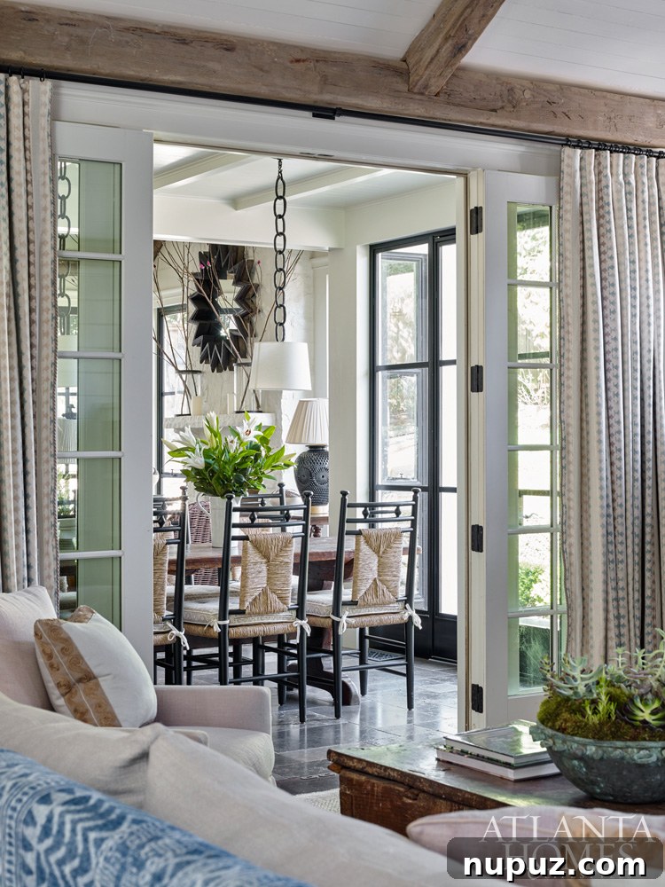 Dining room opening into other living spaces, showcasing harmonious design