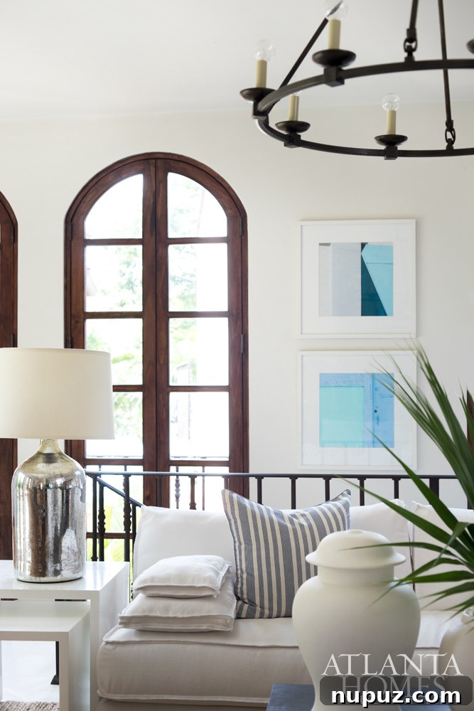 Costa Rica Dream Home Unveiled 3 Open plan living area in a Costa Rica beach house, showcasing seamless indoor-outdoor flow and elegant tropical decor by Beth Webb.