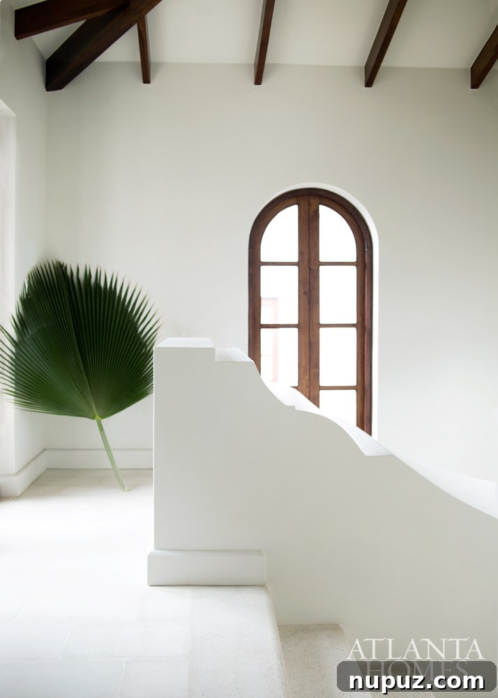 Costa Rica Dream Home Unveiled 6 Elegant hallway and staircase in a Costa Rican beach house, featuring natural wood and a tranquil design.