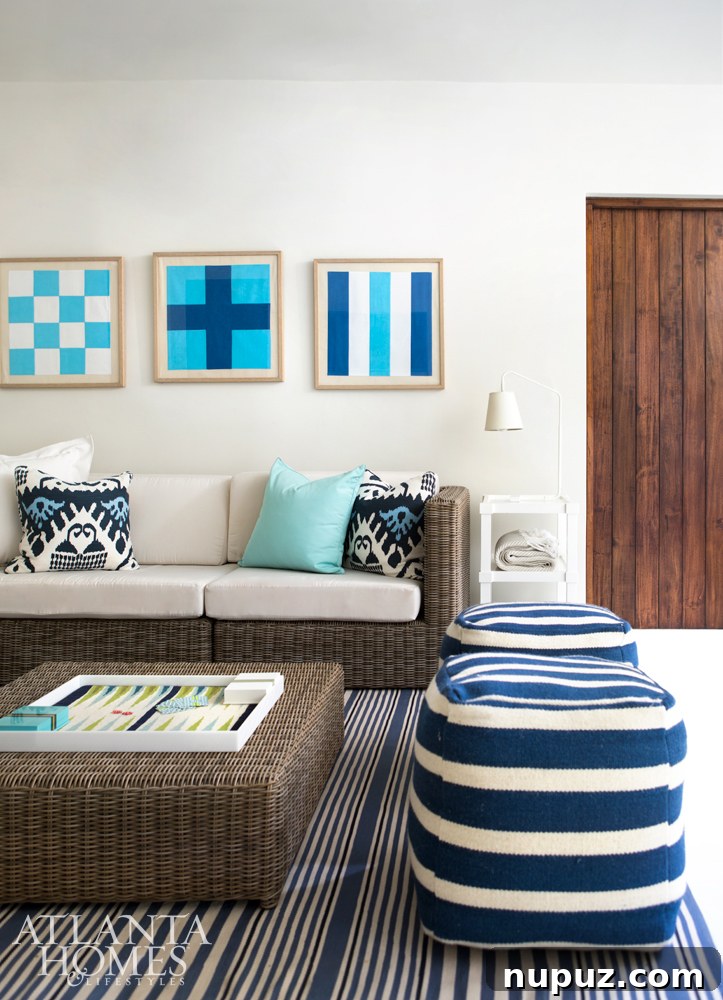 Costa Rica Dream Home Unveiled 10 Inviting porch and sunroom in a Costa Rican beach house with nautical stripes, blue accents, and comfortable seating.