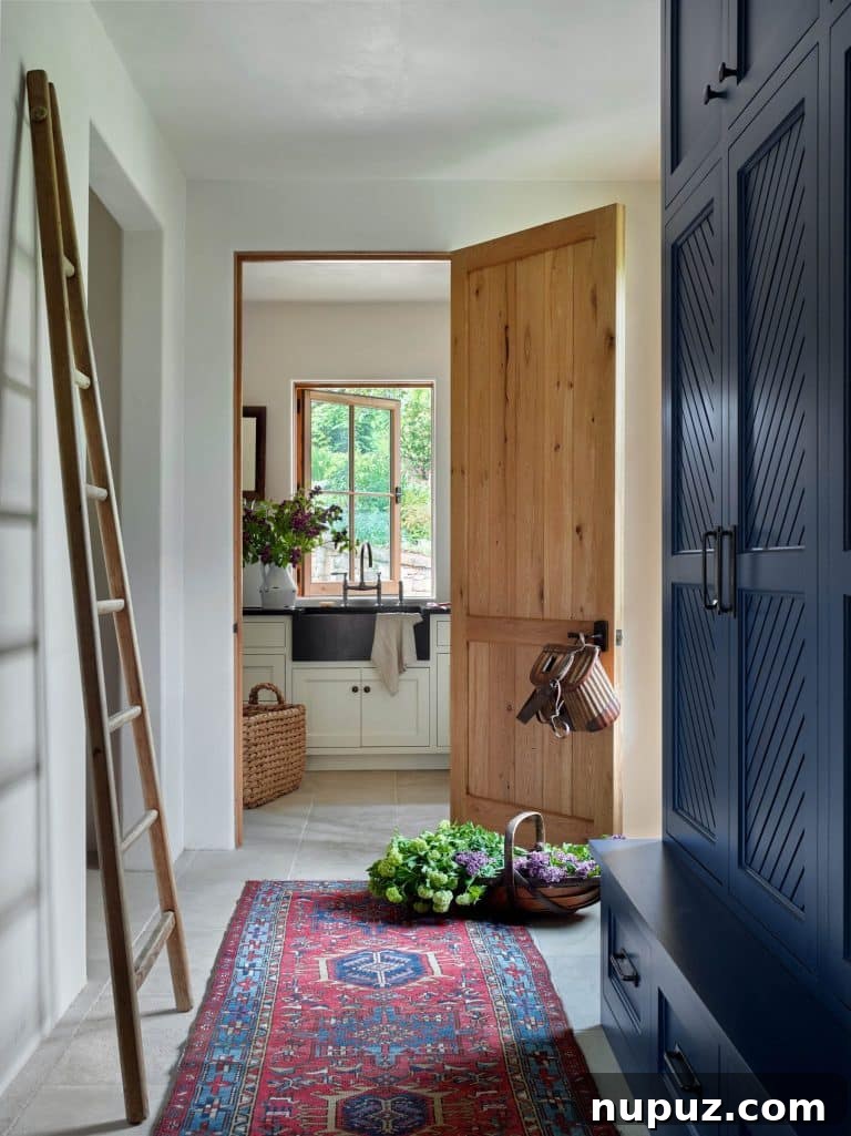 Laundry room with stylish cabinetry and functional design, enhancing everyday living.