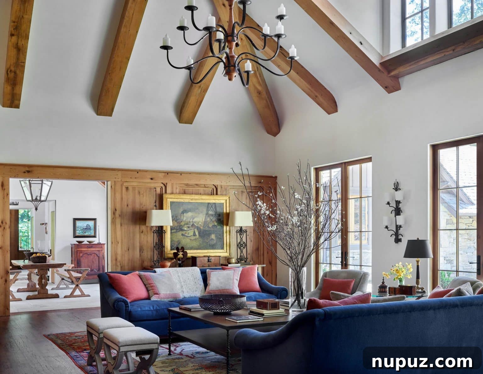 Luxurious kitchen island with sophisticated lighting and bar stools, part of a Georgia horse farm interior.