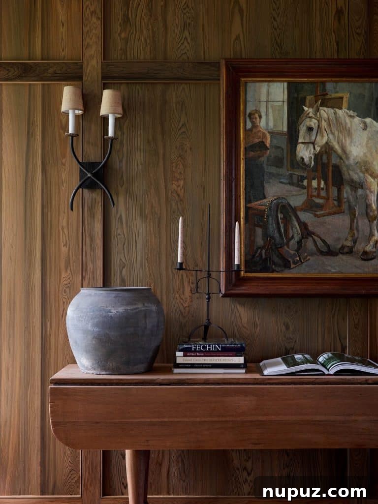 Sunlit living area with comfortable seating and elegant artwork, showcasing The Design Atelier's expertise.