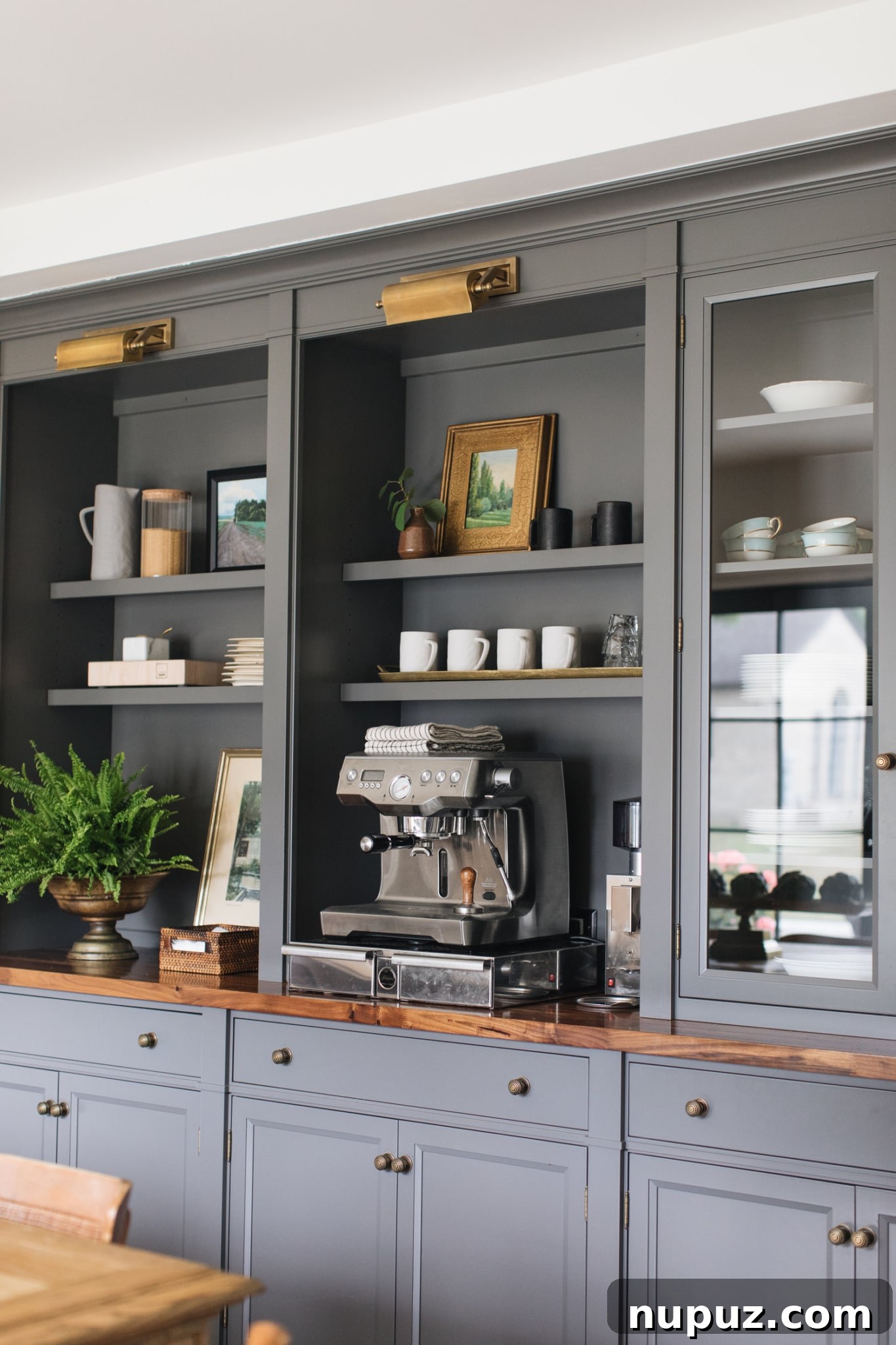 Stylish kitchen interior by Jean Stoffer Design, featuring custom cabinetry and natural light