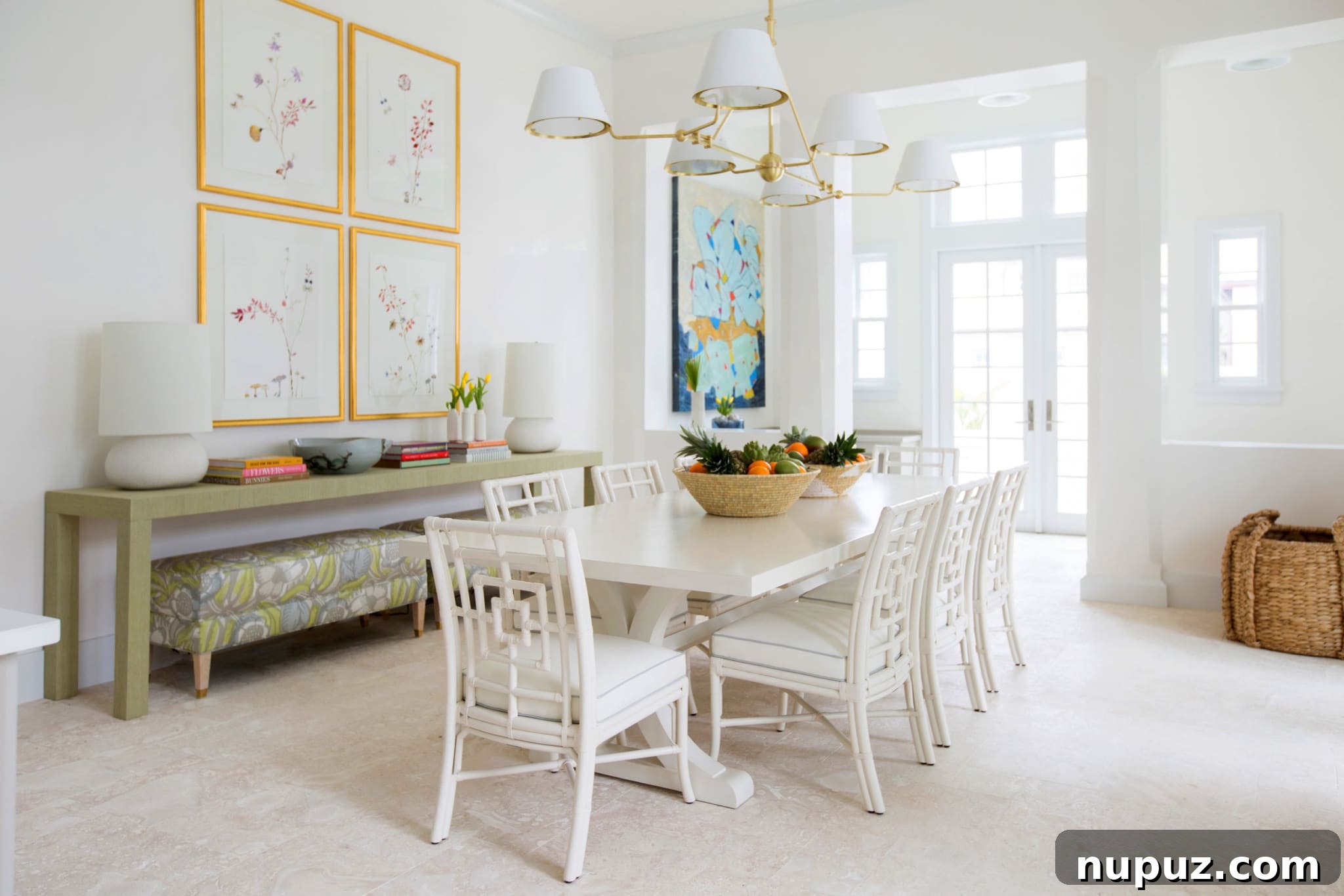 Elevate Your Dining with Jenkins Interiors 3 Bright and airy dining space featuring a round white table, minimalist chairs, and delicate floral arrangements, creating a serene atmosphere.