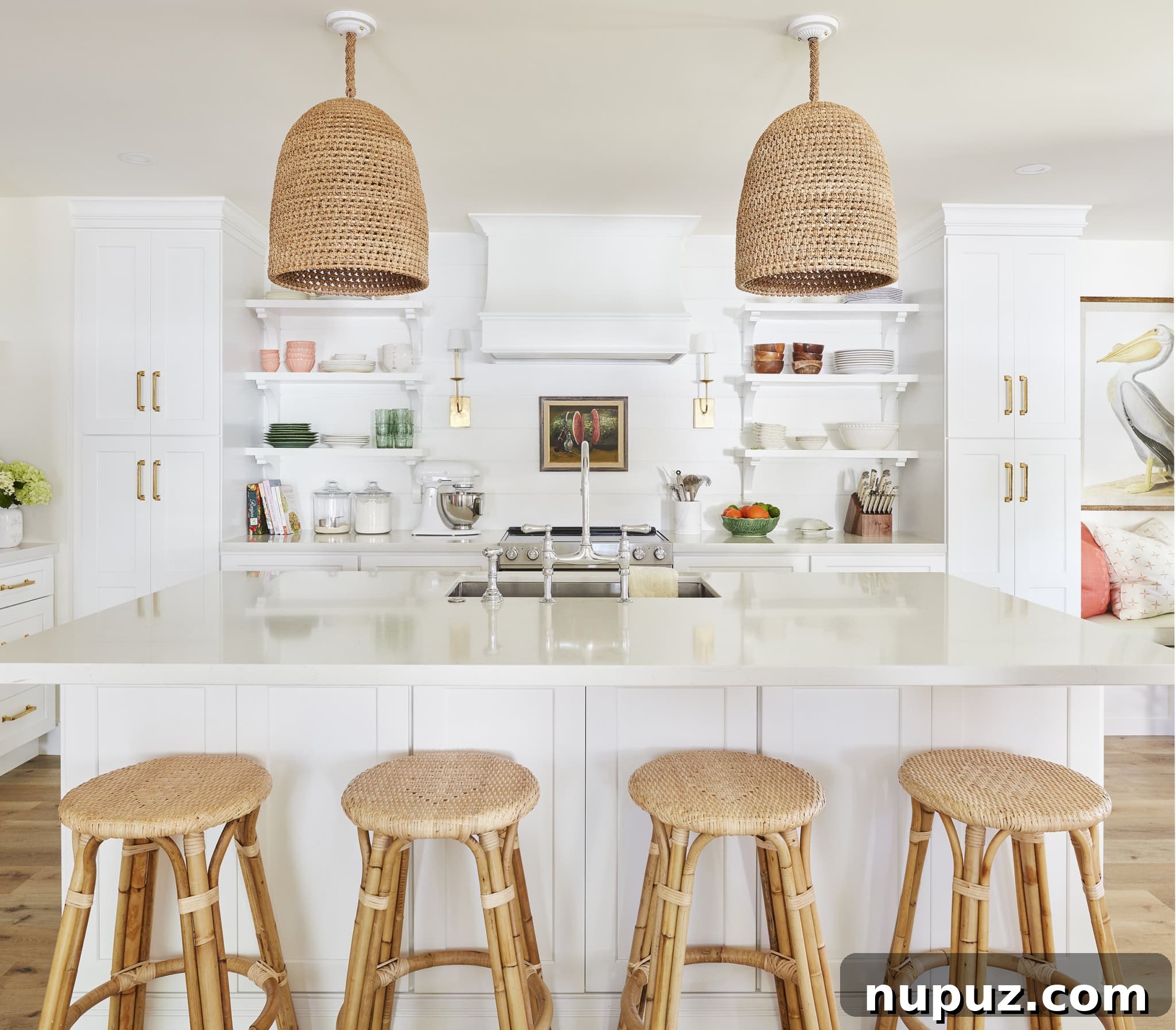 Kara Miller Crafting Kitchens of Unrivaled Beauty 5 A serene and inviting kitchen designed by Kara Miller, featuring pale blue or green cabinetry, a classic white farmhouse sink, and sophisticated fixtures. The bright and airy atmosphere promotes a sense of calm and elegance, expertly photographed by Brantley Photography.