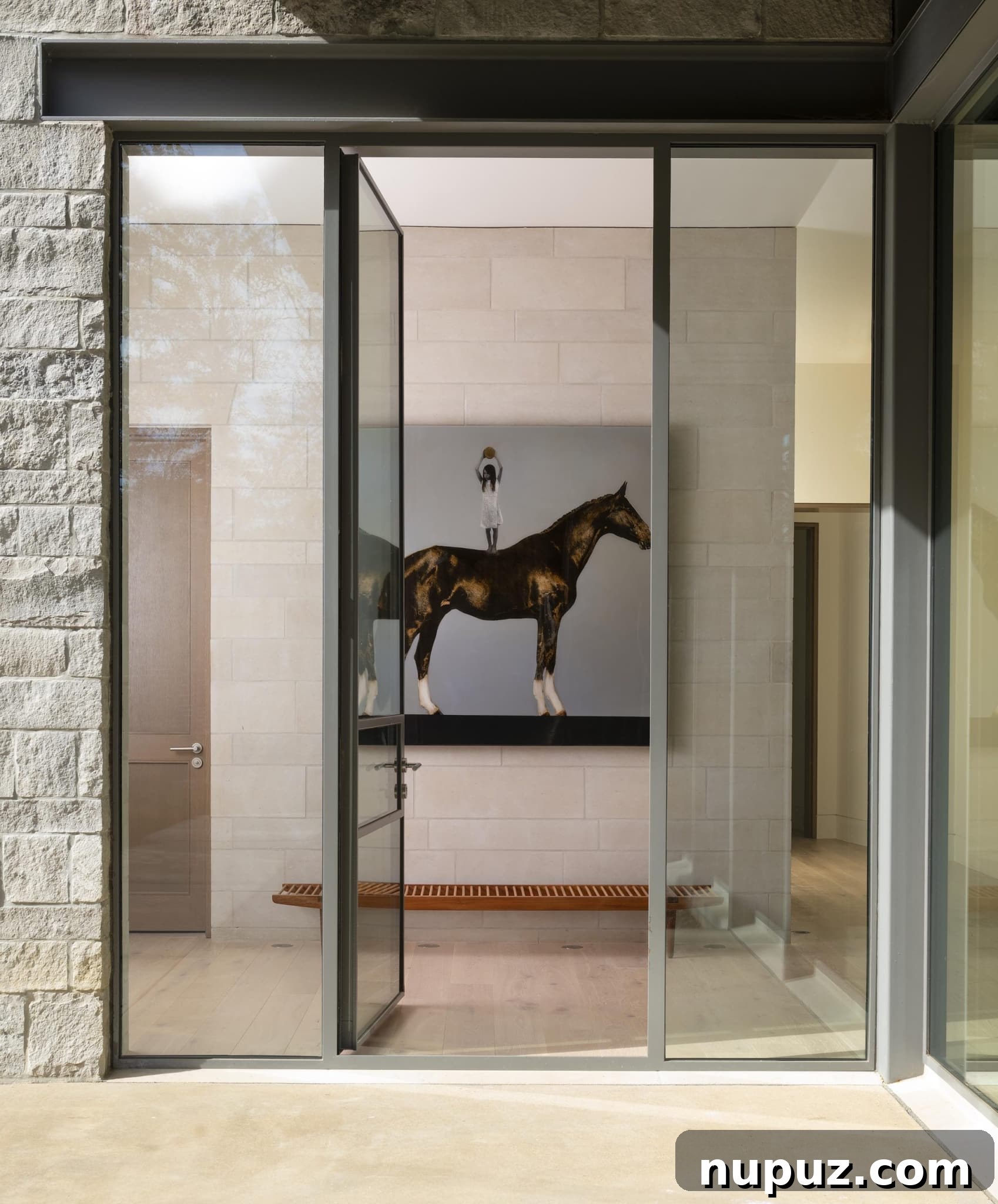 East Texas Glass House: A Modern Architectural Marvel 2 Stunning exterior view of a modern glass house nestled in an East Texas forest, showcasing floor-to-ceiling windows and reflective surfaces overlooking a serene lake.