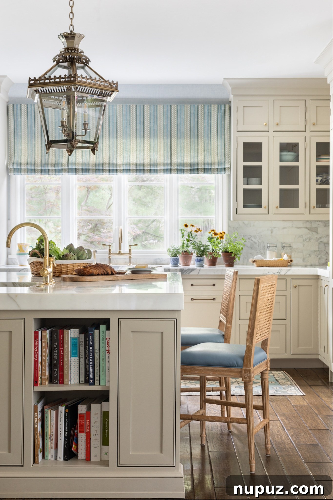Alexandra Kaehler's sophisticated living space design, showcasing a seamless and elegant blend of modern furniture pieces and carefully curated antique decor to create a layered aesthetic.