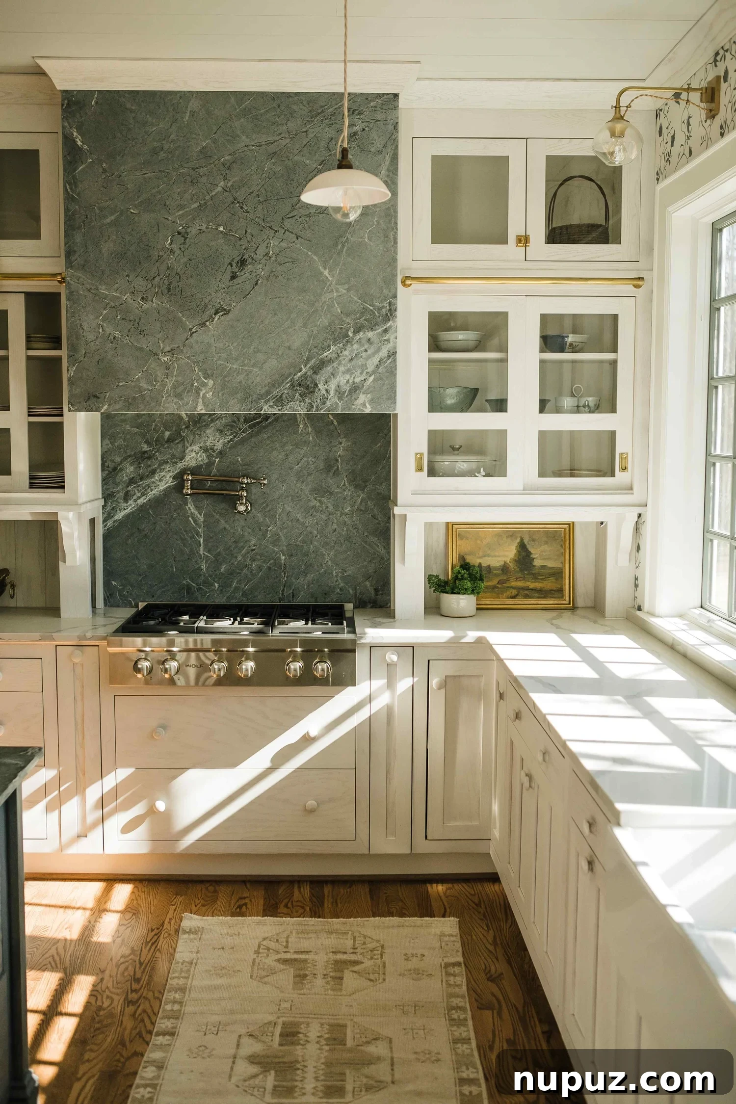 Infuse Your Kitchen with Personality Smart Design Solutions 3 Elegant Misfit House kitchen by Monica Stewart with a stainless steel range hood, brass hardware, and warm wood tones. Kristin Karch Photography.