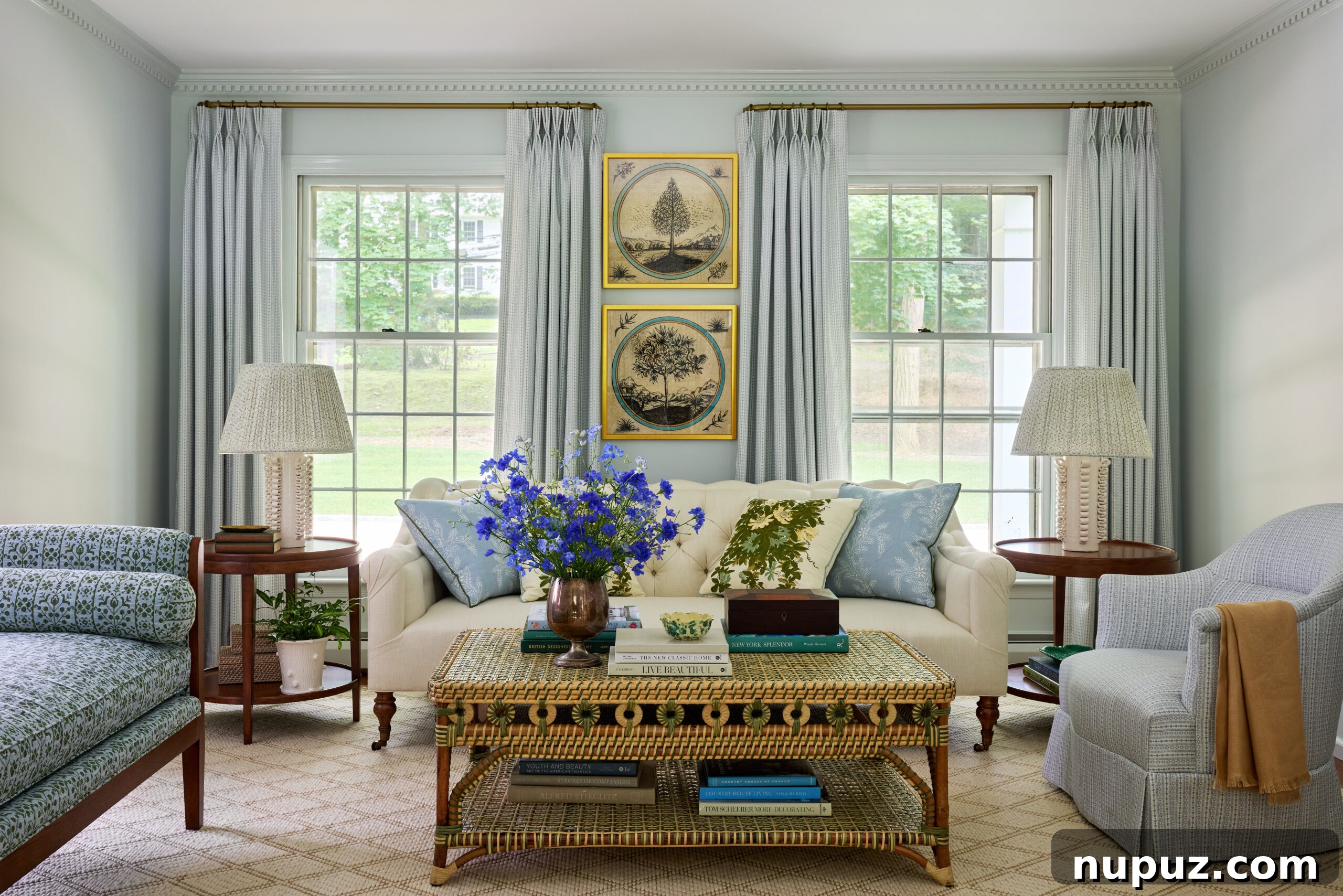 Serene blue and white living room by Jennifer Hunter, featuring exquisite artwork by Mary McGuire, photographed by Kristen Francis.