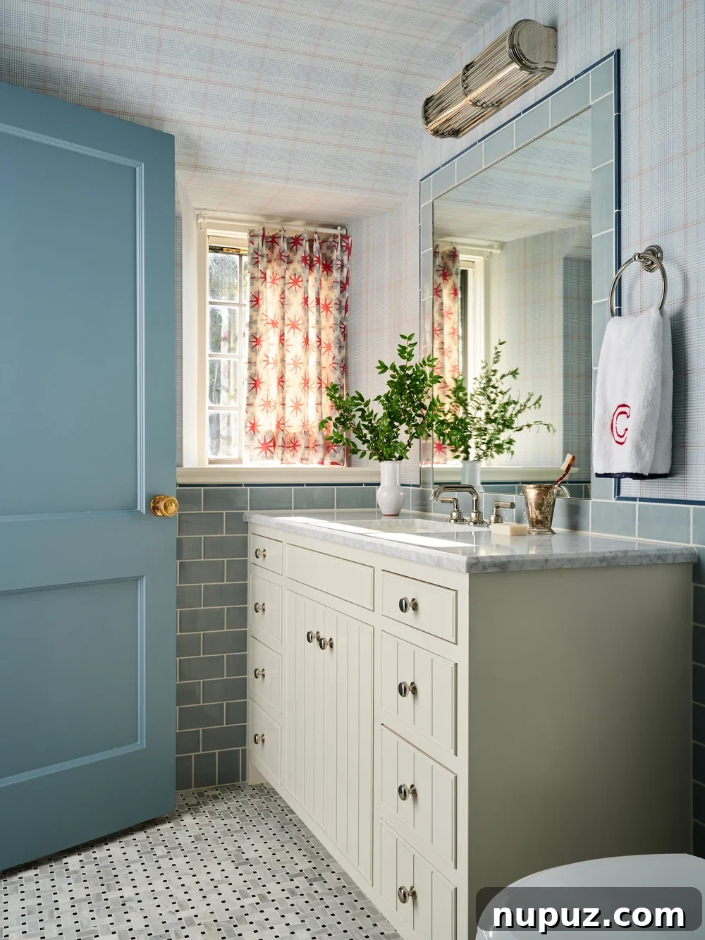 Boy's bathroom featuring vibrant blue tile, a functional and stylish choice by Jenkins Interiors.