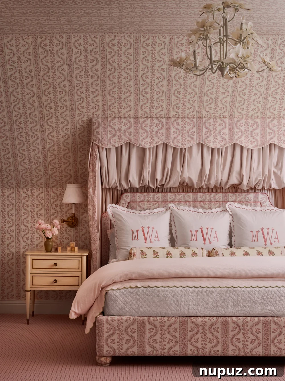Elegant pink bedroom with monogrammed pillows, a personalized touch by Jenkins Interiors.