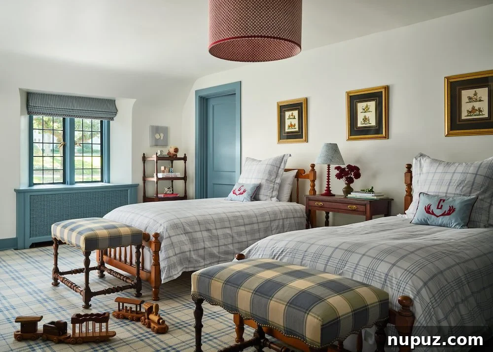 Boy's bedroom with classic blue and white plaid bedding, a cheerful design by Jenkins Interiors.