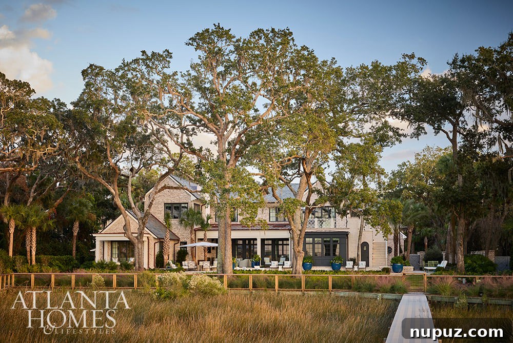 Another captivating exterior angle of the Sea Island home, highlighting the architectural details and expansive outdoor living potential, designed for coastal luxury.