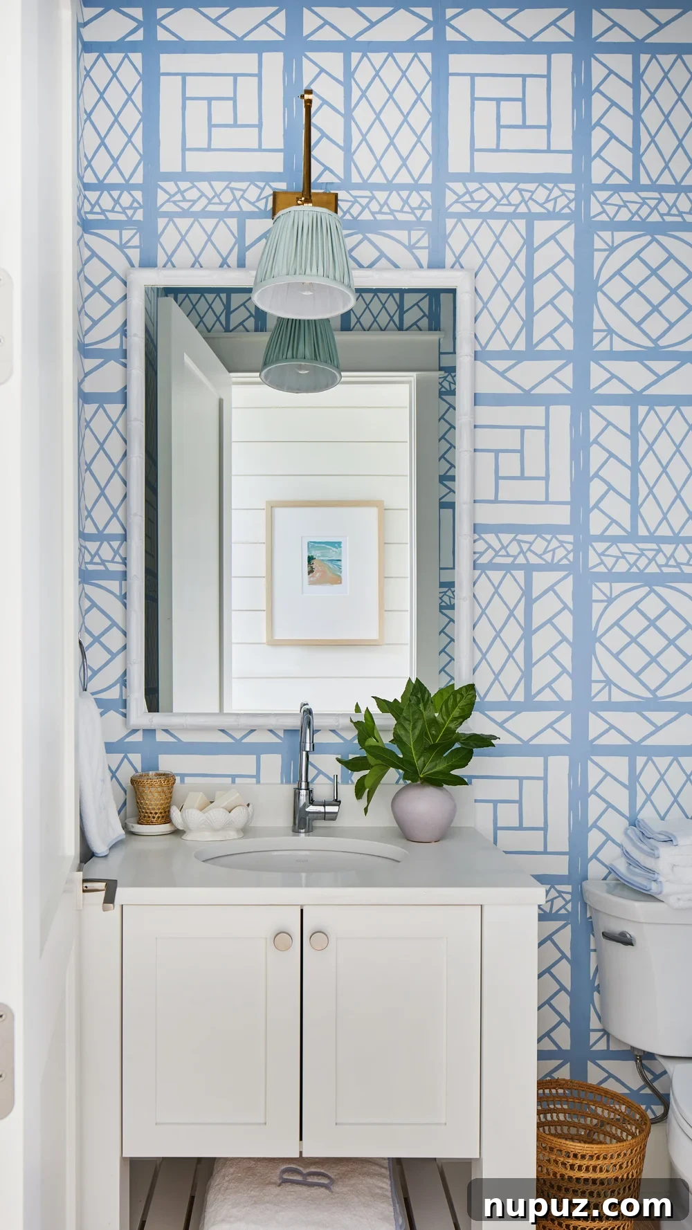Breezy Blue and White Coastal Bliss 15 Stunning accent wall featuring Quadrille Lyford wallpaper in a Kara Miller beach house, adding a touch of sophisticated pattern to the coastal aesthetic.