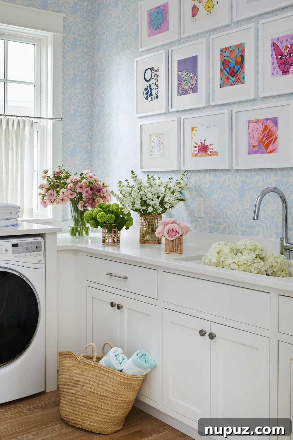 Breezy Blue and White Coastal Bliss 16 Charming laundry room in a Kara Miller-designed beach house, featuring delightful patterned wallpaper that brings style to a functional space.