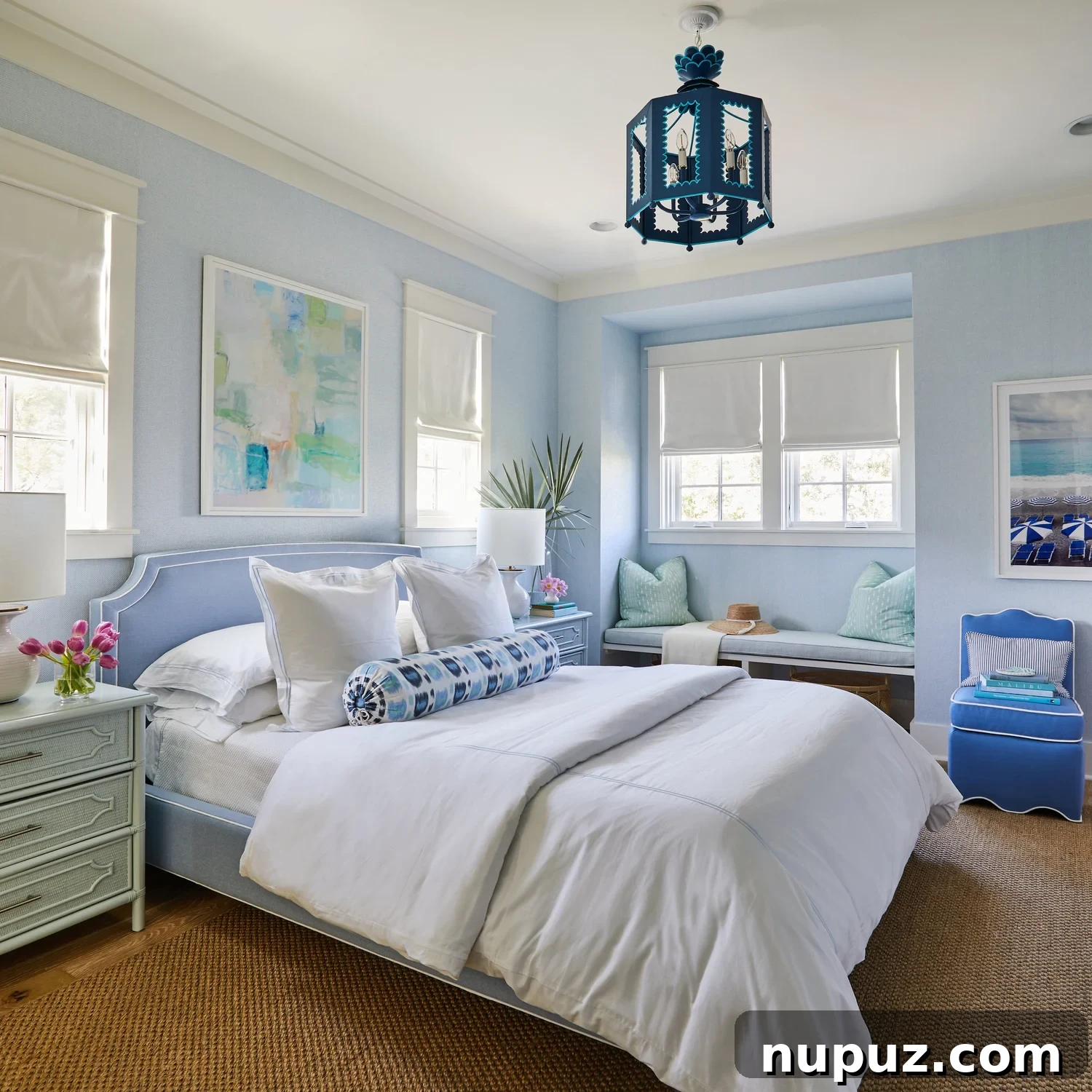 Breezy Blue and White Coastal Bliss 7 Inviting seating area in the Kara Miller beach house, showcasing the harmonious blend of natural materials and subtle blue accents that define the home's aesthetic.
