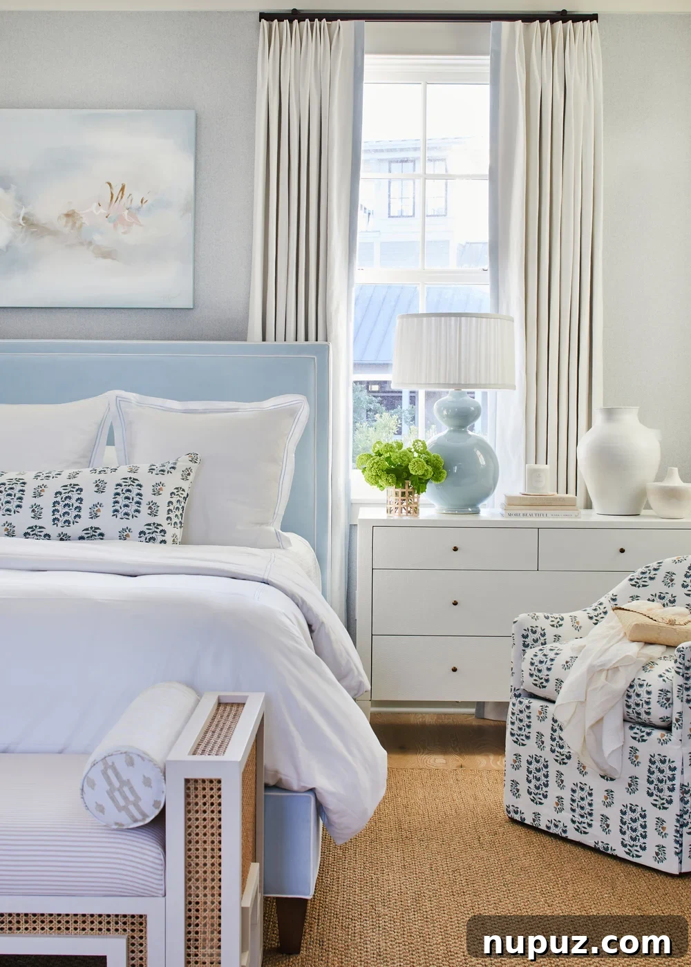 Breezy Blue and White Coastal Bliss 9 Another view of the Kara Miller-designed beach house, highlighting the fresh, inviting ambiance created by a sophisticated blue and white palette and natural textures.