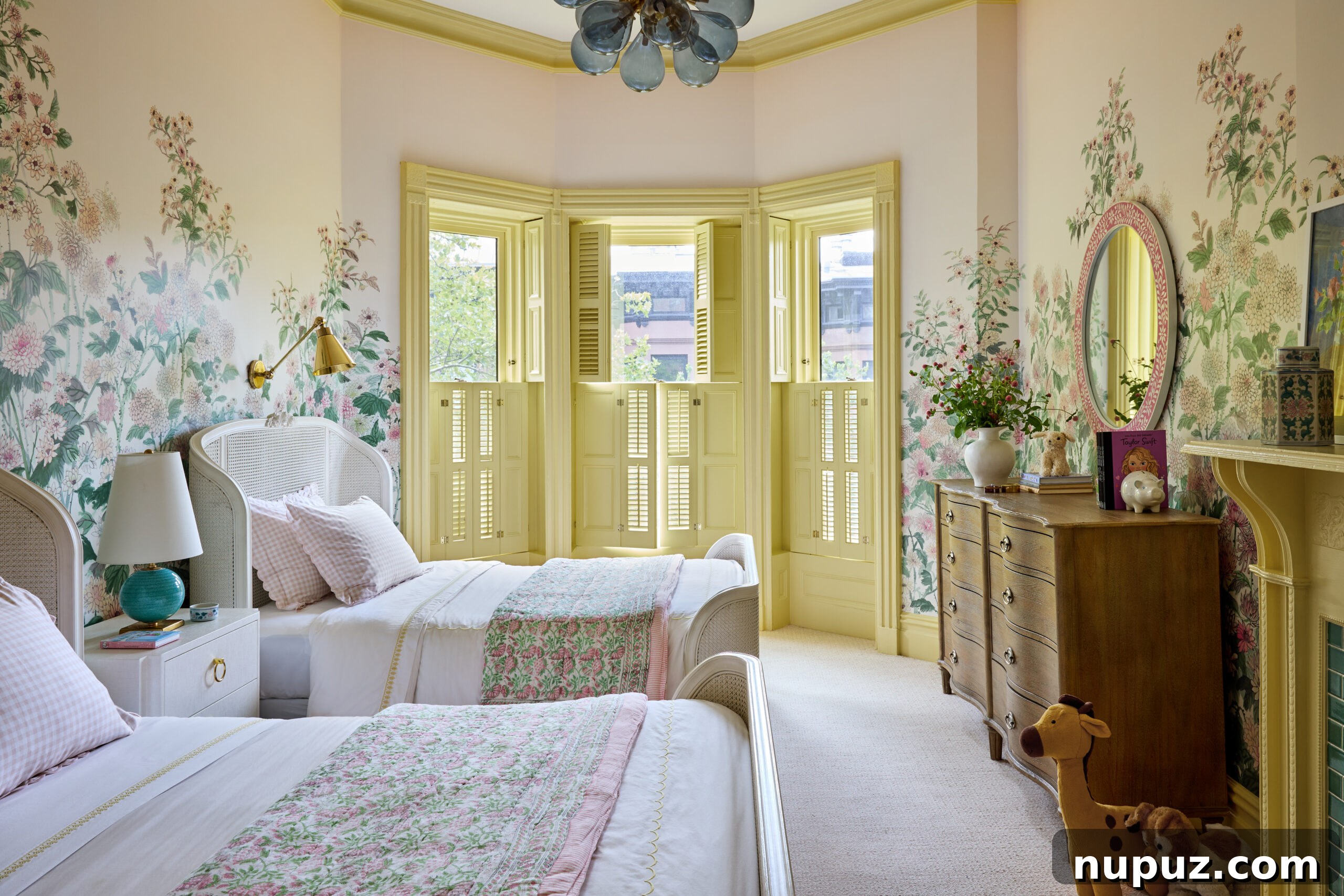 Charming girls' bedroom with handpainted wallpaper and yellow trim