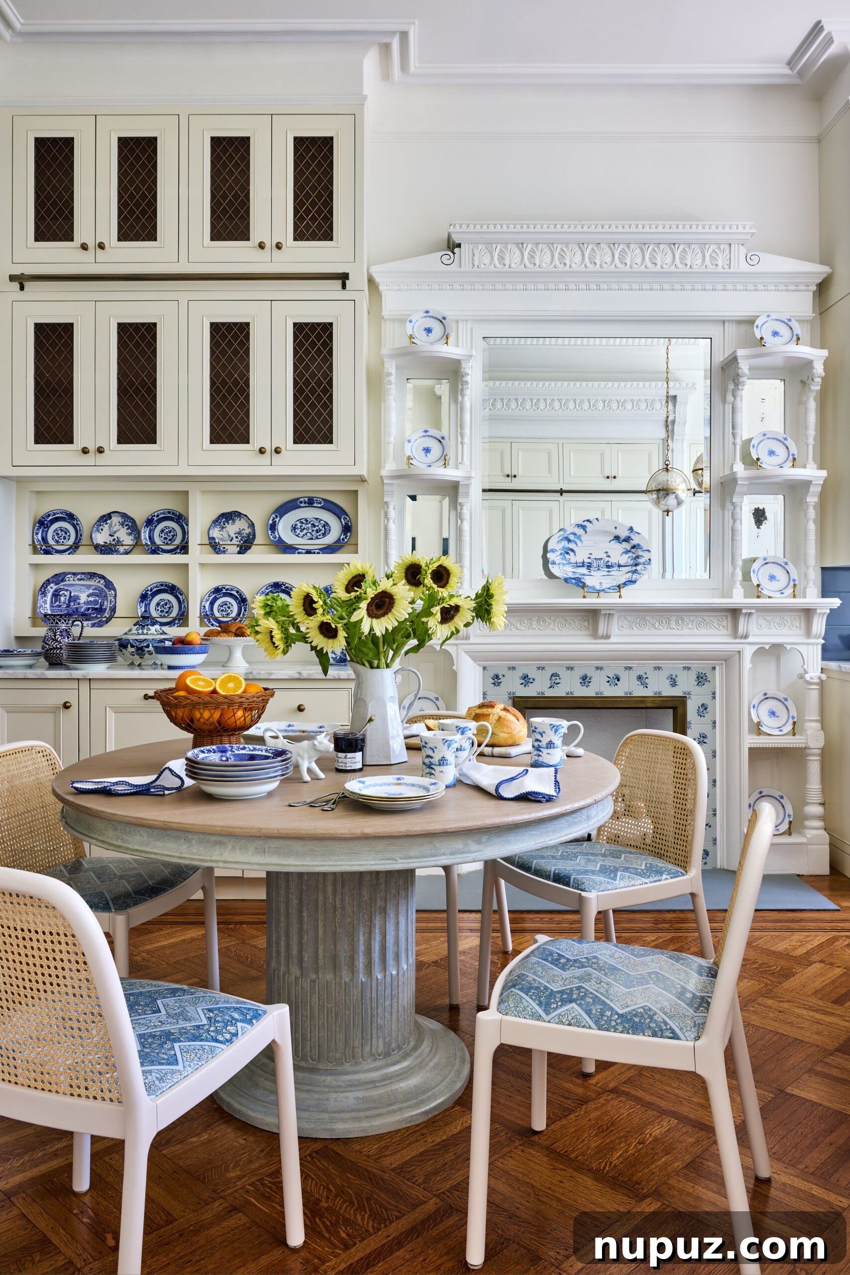 Charming breakfast room with blue and white china and cane back chairs