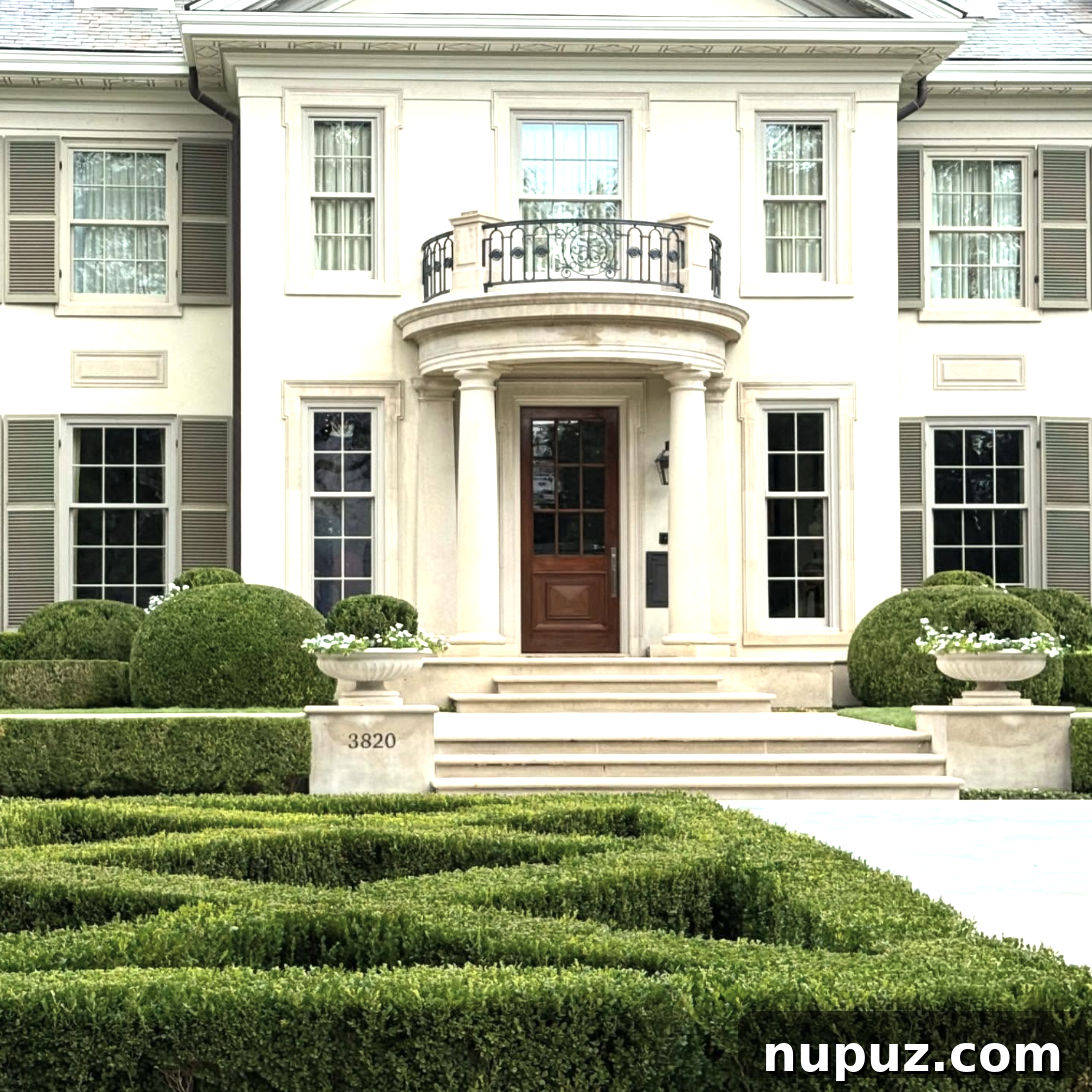 7 Homes Where Boxwoods Command the Landscape 6 Coastal residence with informal boxwood groupings creating a relaxed yet sophisticated garden aesthetic, blending tradition with modern sensibilities.