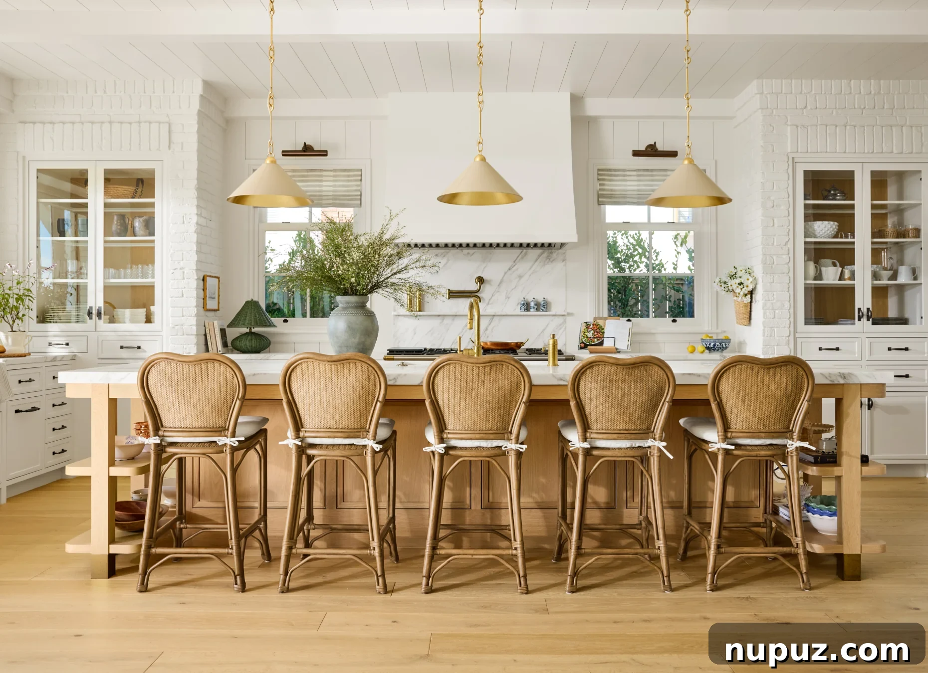 Bring Studio McGee Style Home: A Room-by-Room Decorating Guide 3 We absolutely adore the work of Studio McGee Interior Design–and husband/wife team Syd and Shea McGee. Their work is enviable to say the very least and strikes that rare balance between elevated and livable. We love the wicker stools in the kitchen with the ivory pendant lights