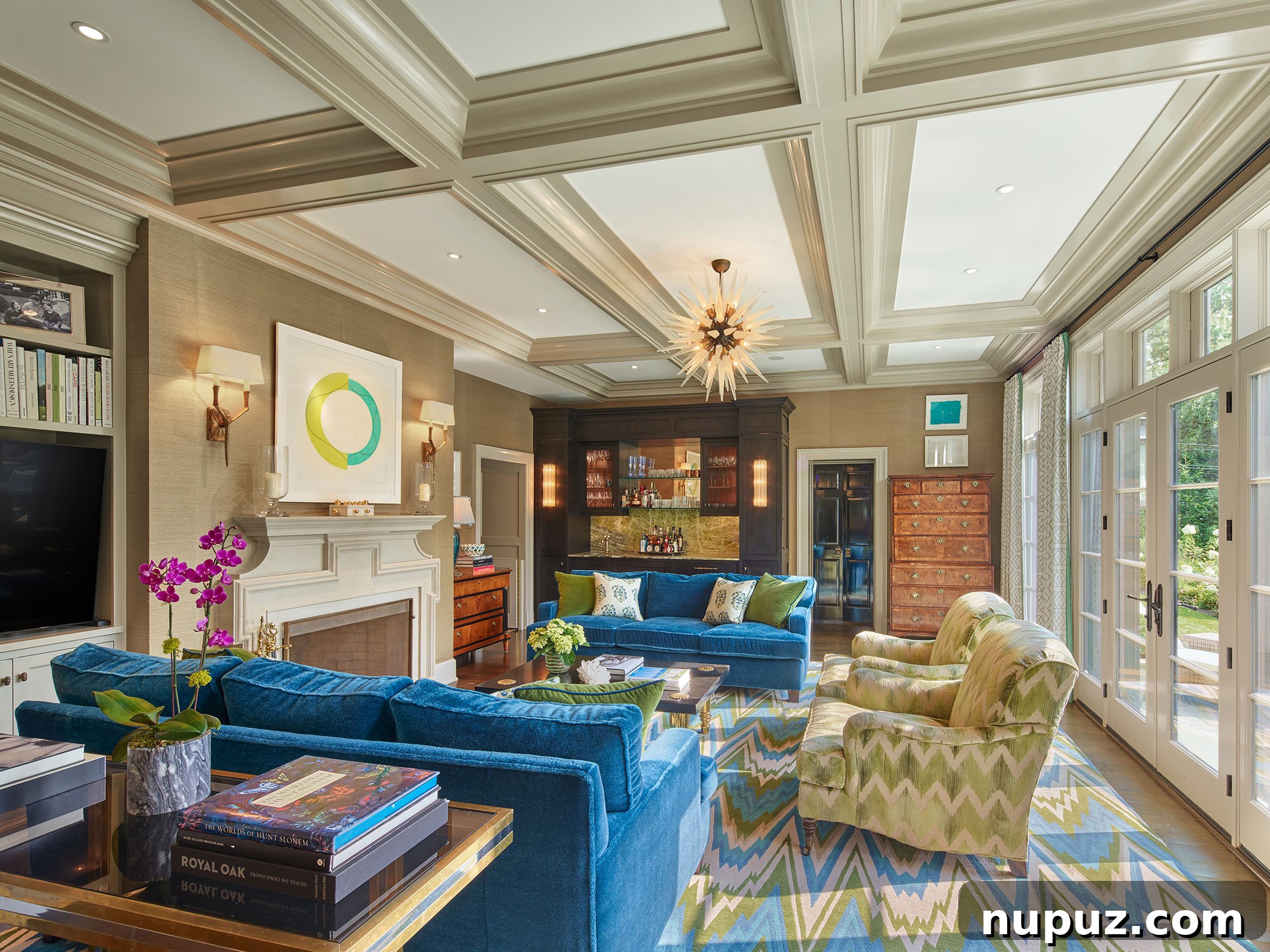 Vibrant family room with coffered ceilings and flame stitch rug