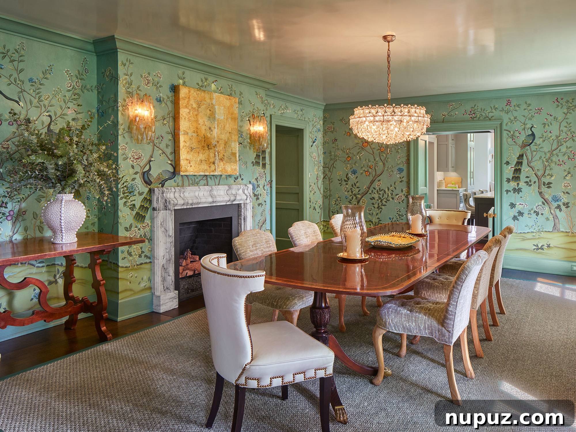 Dining room with long oval table and handpainted deGournay wallpaper