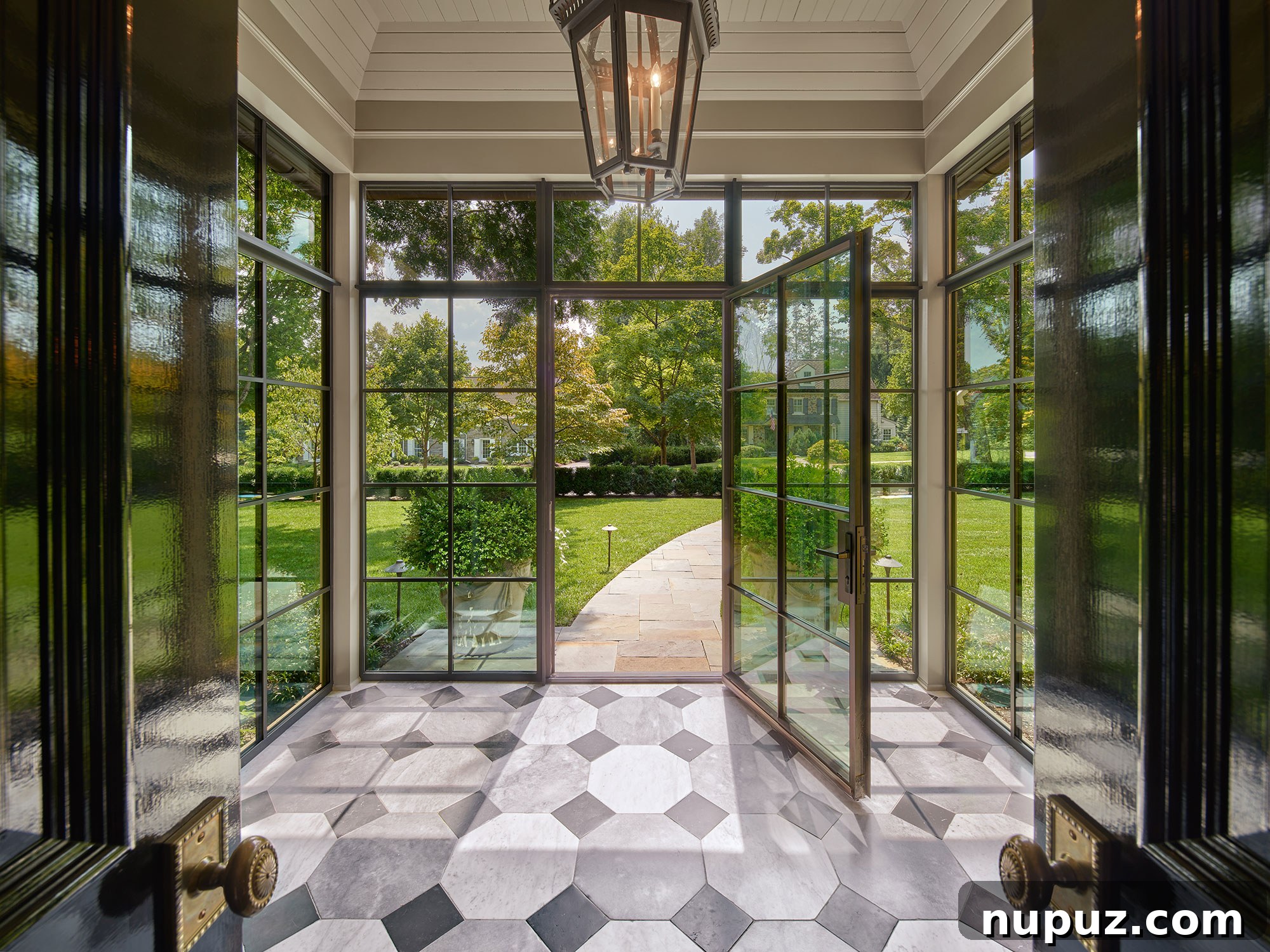 Back entry with marble floors and steel doors