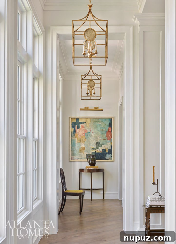 Beautiful hallway with brass chandeliers and abstract art