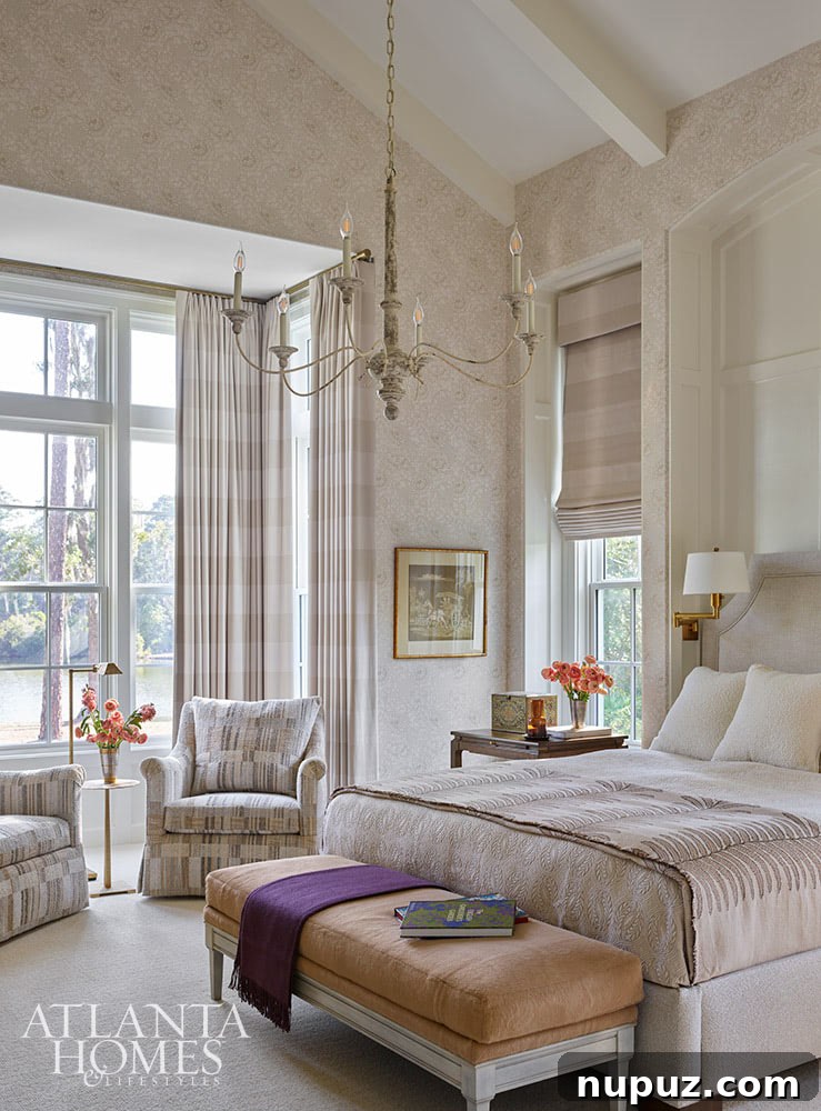 Neutral primary bedroom with chandelier and sitting area