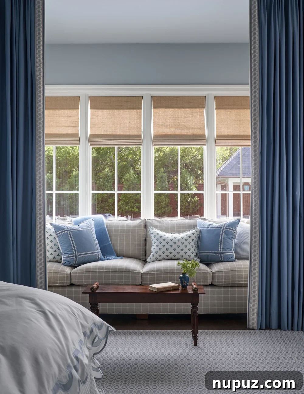 Jenkins Interiors | Nathan Schroder Photography - sofa in bedroom with curtains surrounding - cozy reading nook