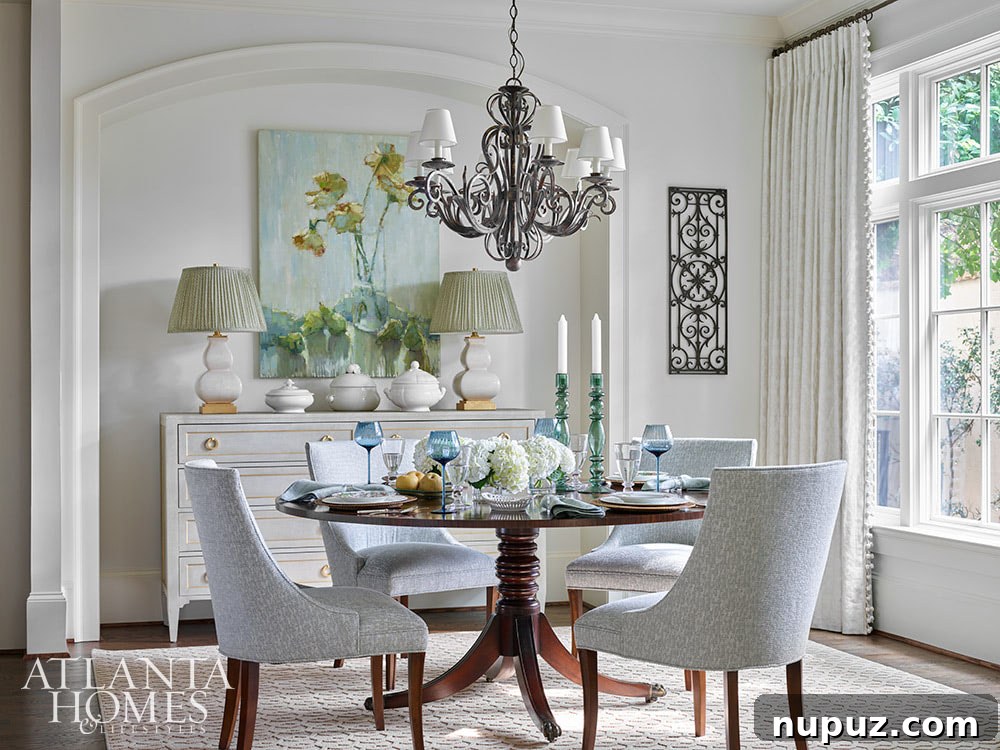This gorgeous Atlanta, Georgia condo fits a lot of style into a smaller space. It's a perfect example of classic city living with timeless interior design done right. Interior Design: Lauren Davenport, Davenport Designs,  Original Architect: Clay Ulmer, Renovation Builder: Matthew Morris, MT Morris Construction, | Photographer: Emily Followill Photography - round dining table 