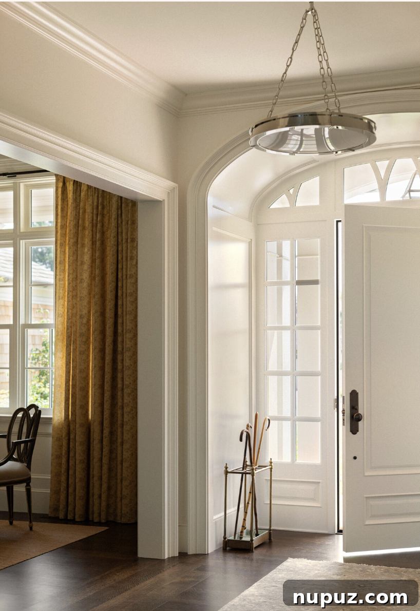 Timeless Home Tour: Warm Neutrals and Layered Interior Style 2 Entryway with beautiful arched doorway and side panel windows