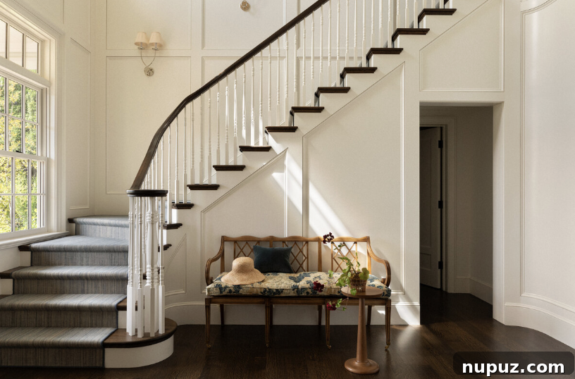 Timeless Home Tour: Warm Neutrals and Layered Interior Style 3 Entry with curved staircase