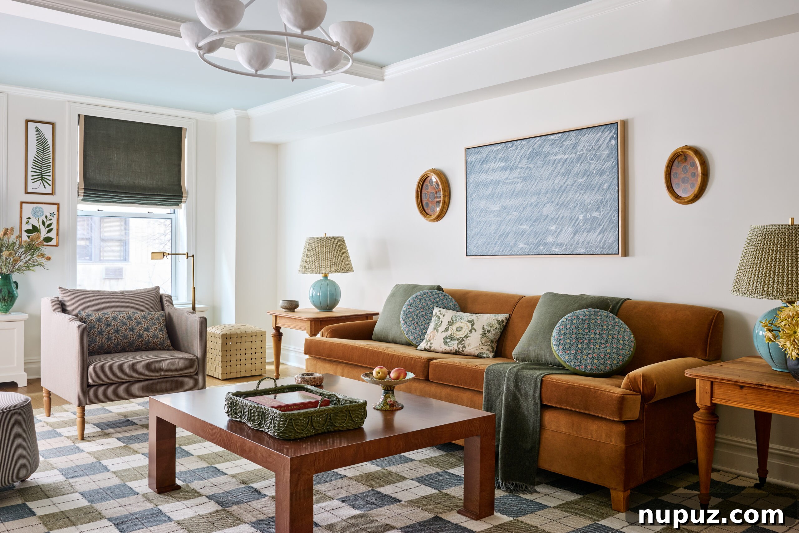 Living room with velvet sofa and abstract art