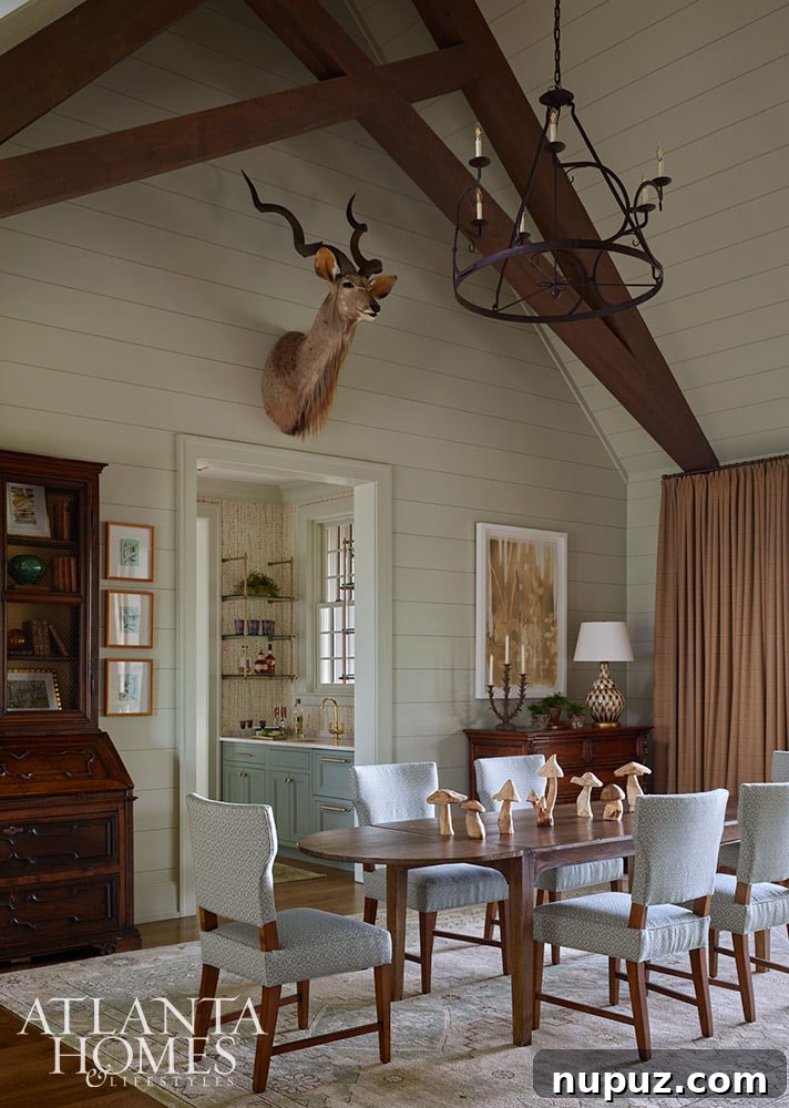 Dining room with shiplap walls and wood beams