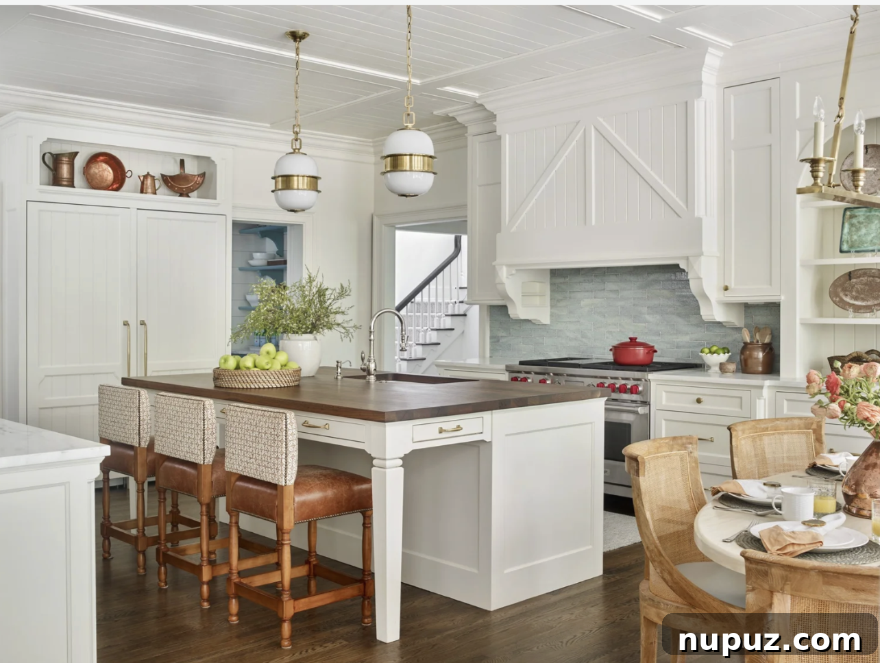 Bright white kitchen with butcher block island and classic details