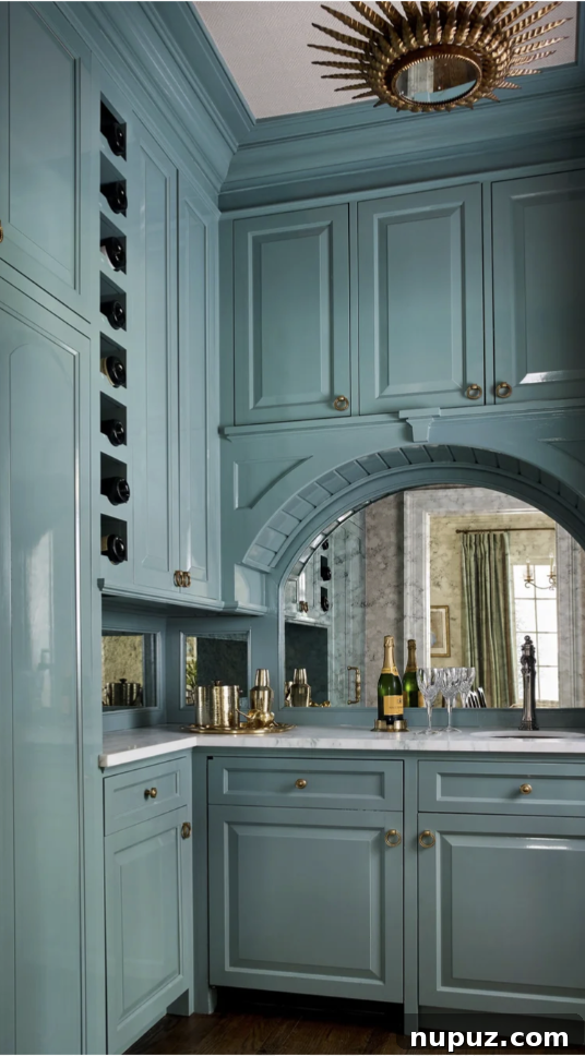 Moody blue scullery with cabinetry and classic hardware