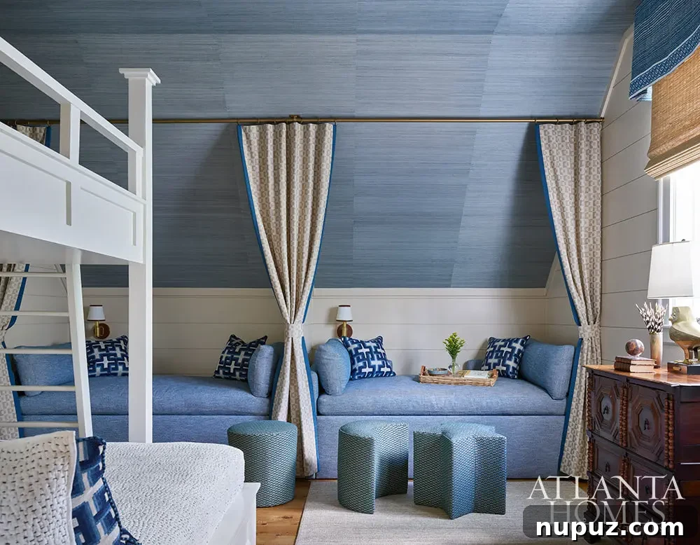 Blue grasscloth on the walls of the bunk room with curtains separating the beds