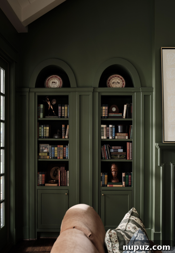 Beautiful dark green arched bookcases
