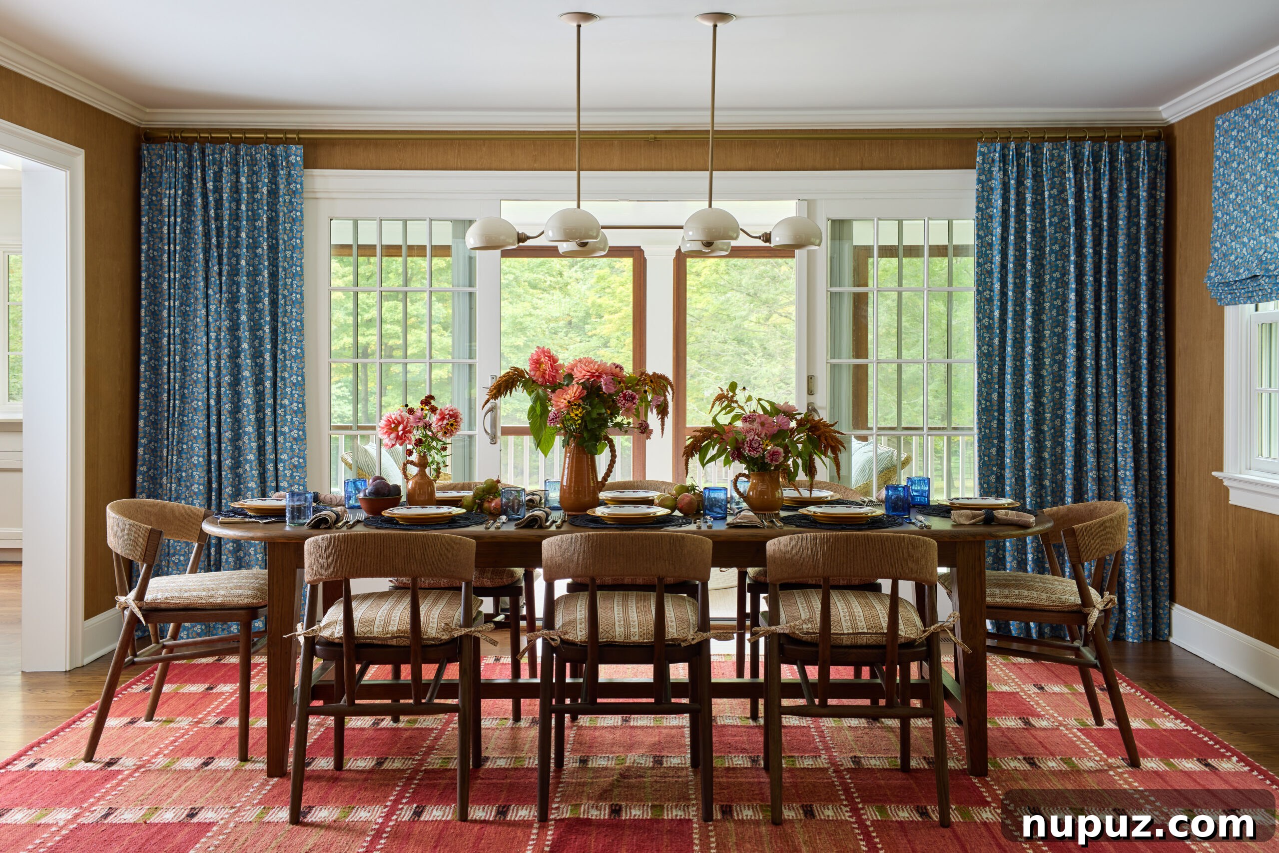 Jennifer Hunter creates perfect spaces in this timeless Bedford home. Charming dining room with a red carpet that adds a punch of color