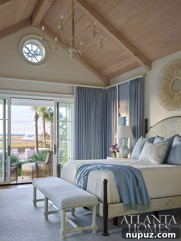 Blue and white bedroom with wood paneled vaulted ceiling