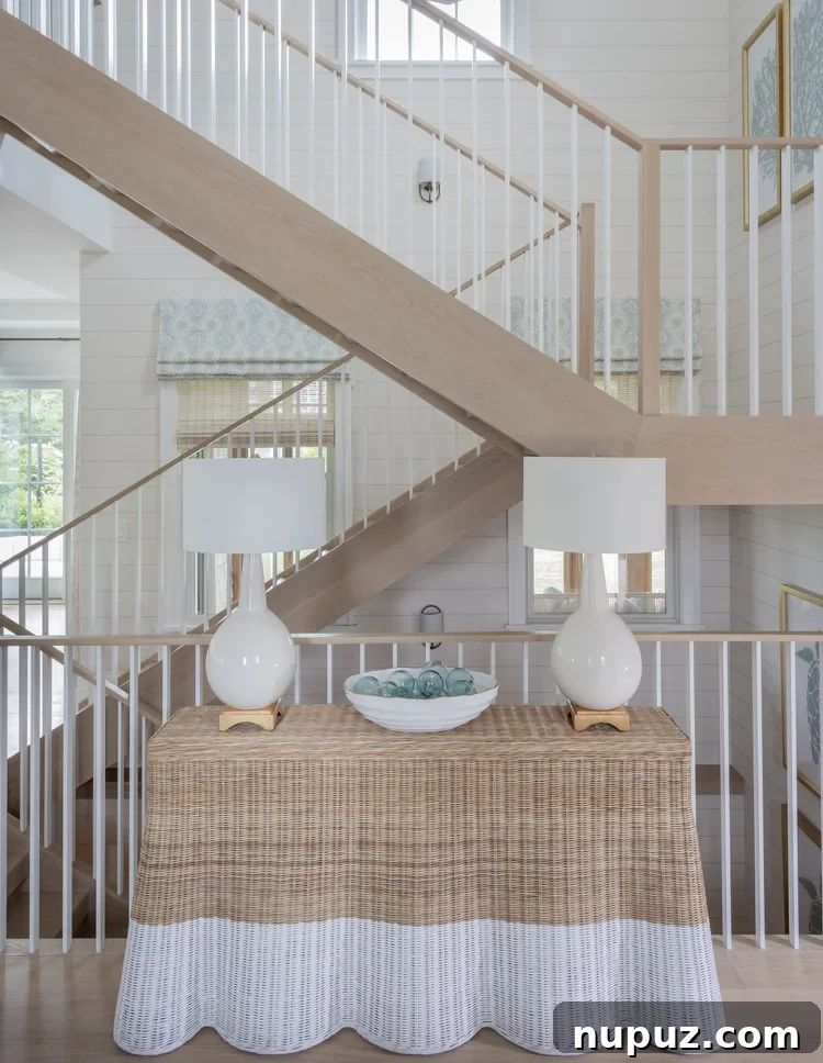 Foyer with wicker table in Nantucket beach cottage
