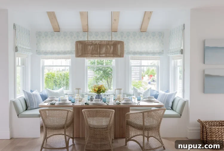 Dining banquette in blue and white with wood beams overhead