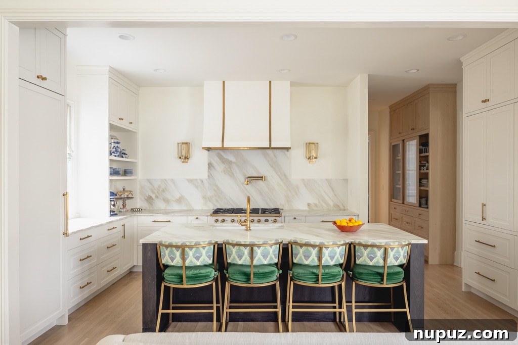 Bright white kitchen with green stools and classic finishes
