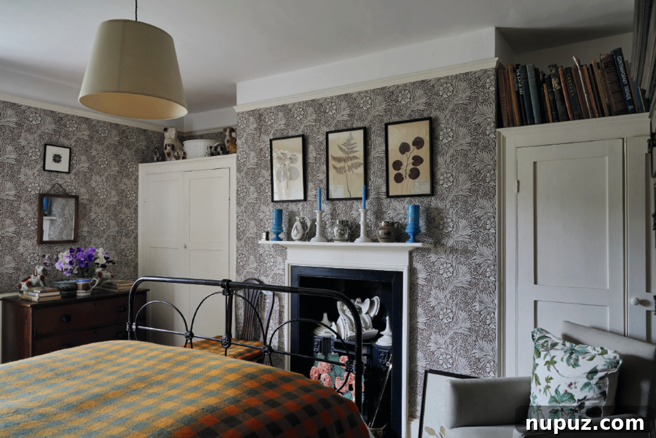 Inside Ben Pentreath's Stylish Home and Interior Design 3 Bedroom with checked bedspread and English pattern wallpaper